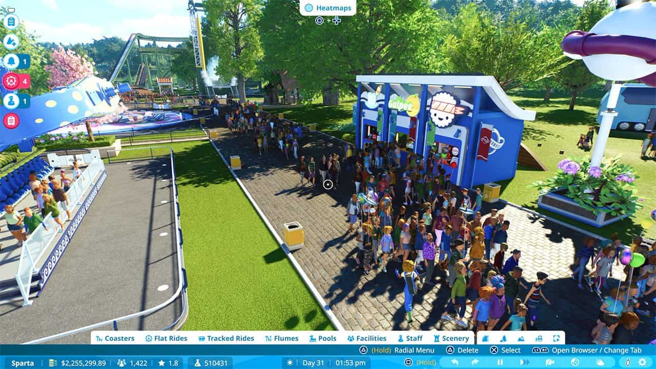 Guests walking around a park in Planet Coaster 2